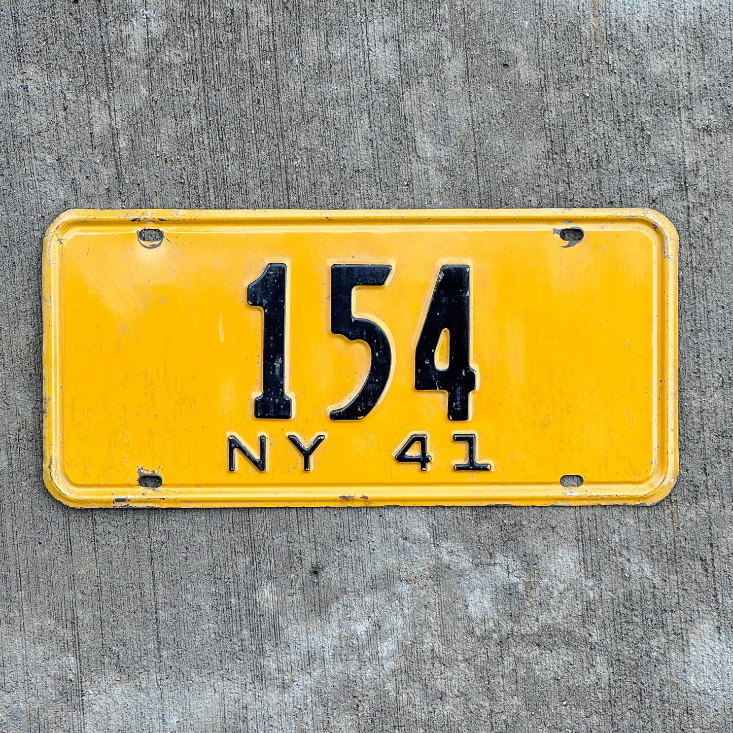 Photo of a 1941 New York Reserved License Plate Auto Tag Garage Decor Vintage ALPCA Archive Example Low Number Three Digit 154 with original patina