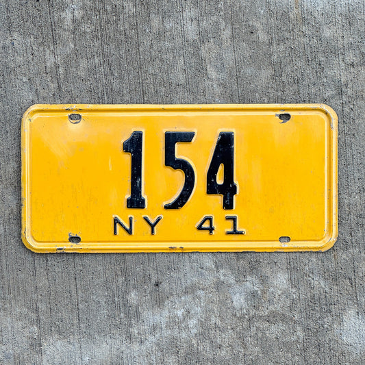 Photo of a 1941 New York Reserved License Plate Auto Tag Garage Decor Vintage ALPCA Archive Example Low Number Three Digit 154 with original patina