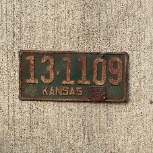 Photo of a 1942 1943 Kansas License Plate Auto Tag Garage Decor Vintage Wildflower 13 1109 with original patina