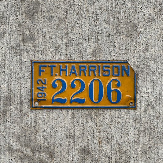 Photo of a 1942 Ft Harrison Indiana License Plate Topper Auto Tag Garage Decor Vintage Military 2206 with original patina