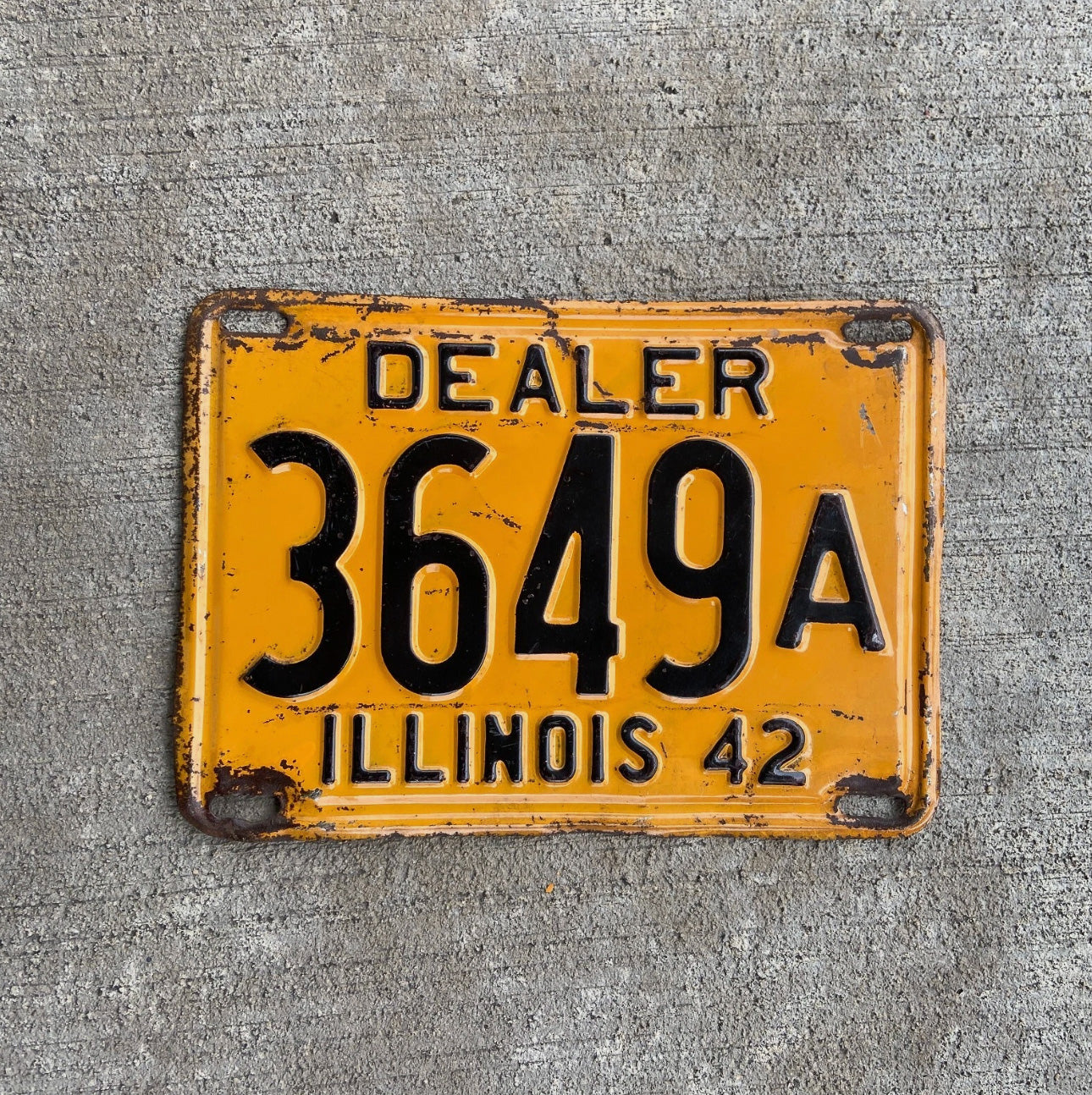 Photo of a 1942 Illinois Dealer License Plate Auto Tag Garage Decor Vintage Low Number Four Digit 3649 A with original patina