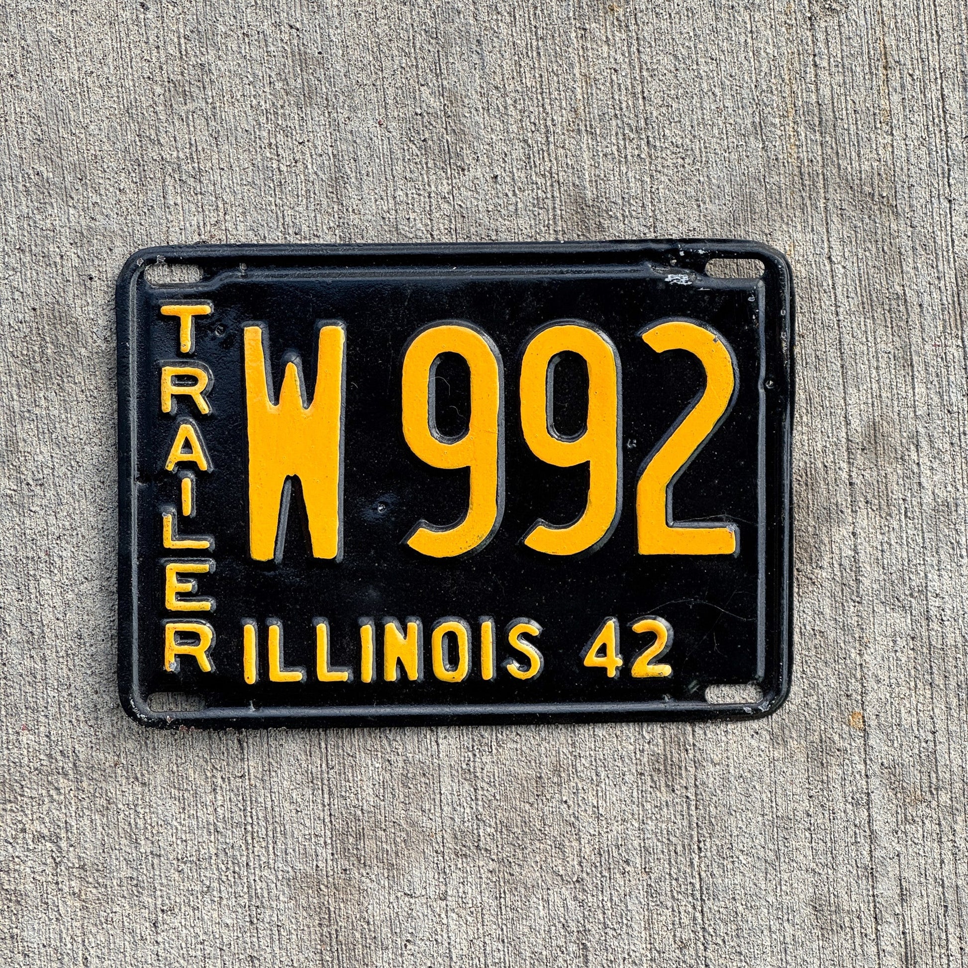 Photo of a 1942 Illinois Trailer License Plate Auto Tag Garage Decor Vintage Low Number Three Digit W 992 with original patina