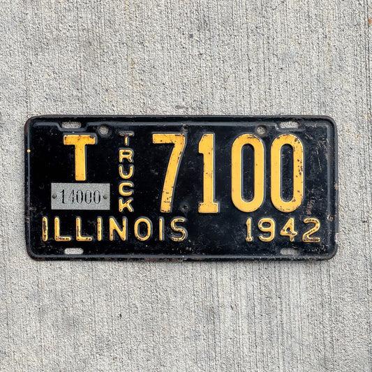 Photo of a 1942 Illinois Truck Mileage Tax License Plate Auto Tag Garage Decor Vintage 14000 LBS T 7100 with original patina