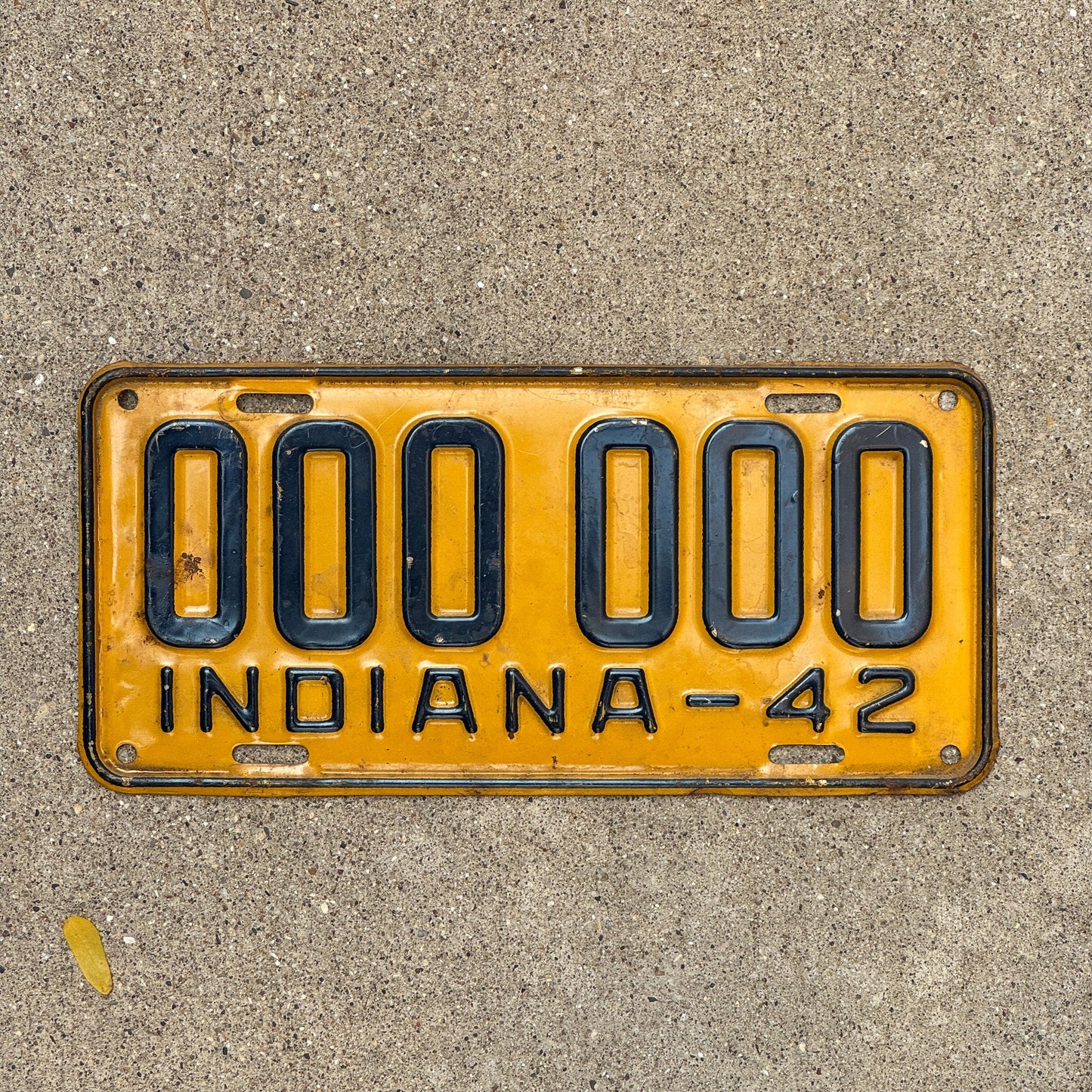 Photo of a 1942 Indiana Sample License Plate Auto Tag Garage Decor Vintage 000 000 with original patina
