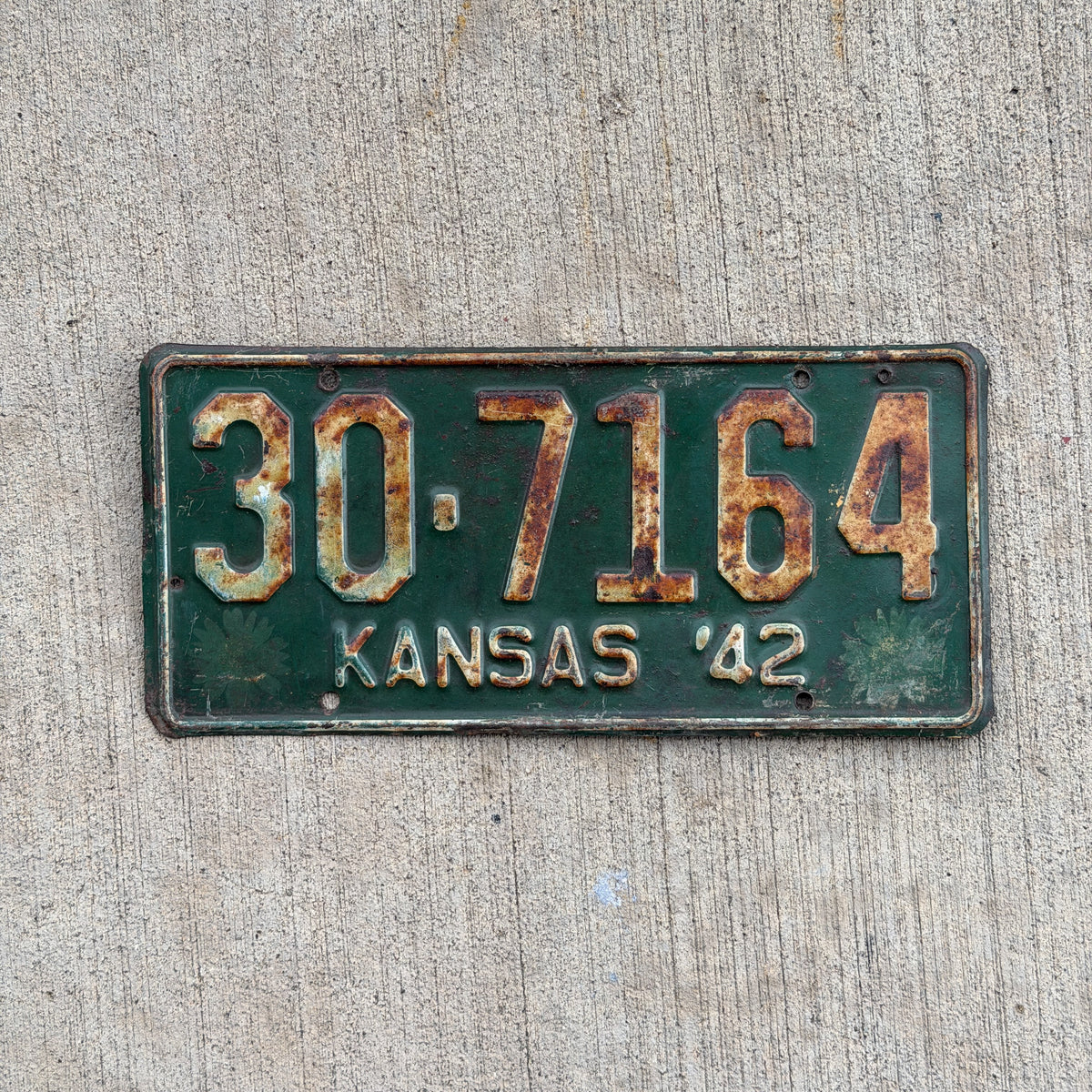Photo of a 1942 Kansas License Plate Auto Tag Garage Decor Vintage Sunflower Base 30 7164 with original patina