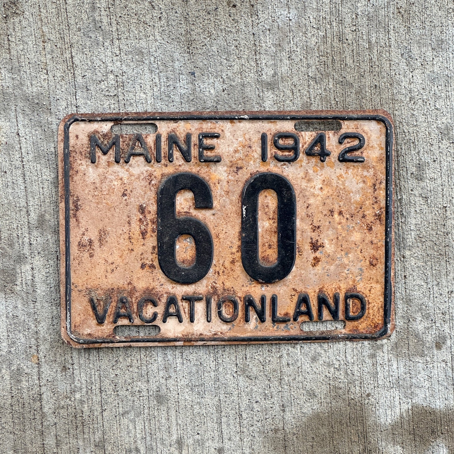 Photo of a 1942 Maine License Plate Auto Tag 1 Vintage Garage Low Number Two Digit 60 with original patina