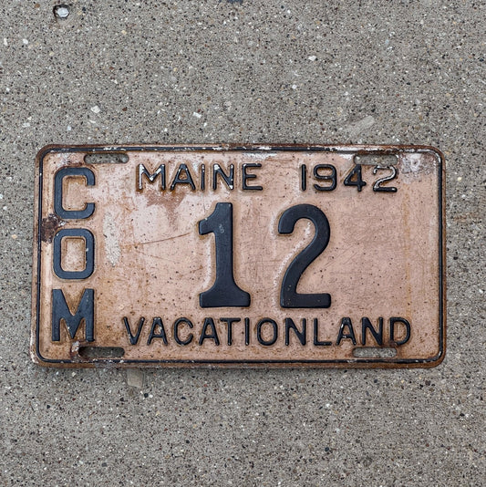 Photo of a 1942 Maine Truck License Plate Auto Tag 1 Vintage Garage Low Number Two Digit 12 with original patina