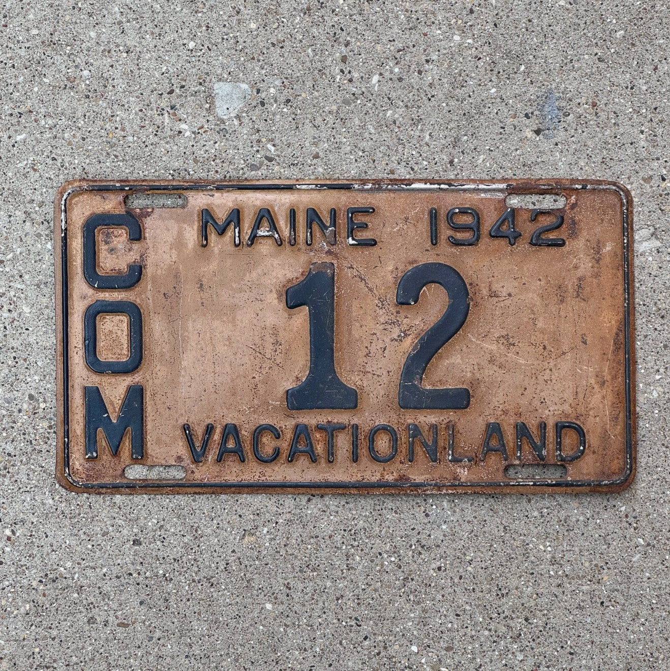 Photo of a 1942 Maine Truck License Plate Auto Tag 2 Vintage Garage Low Number Two Digit 12 with original patina