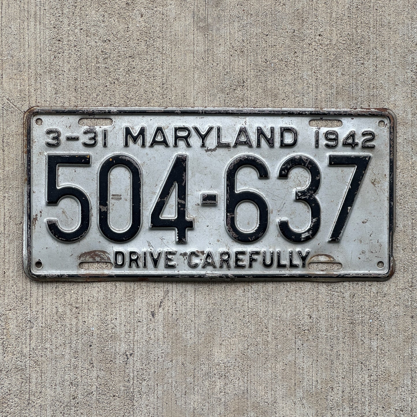 Photo of a 1942 Maryland License Plate Auto Tag Garage Decor Vintage 504 637 with original patina