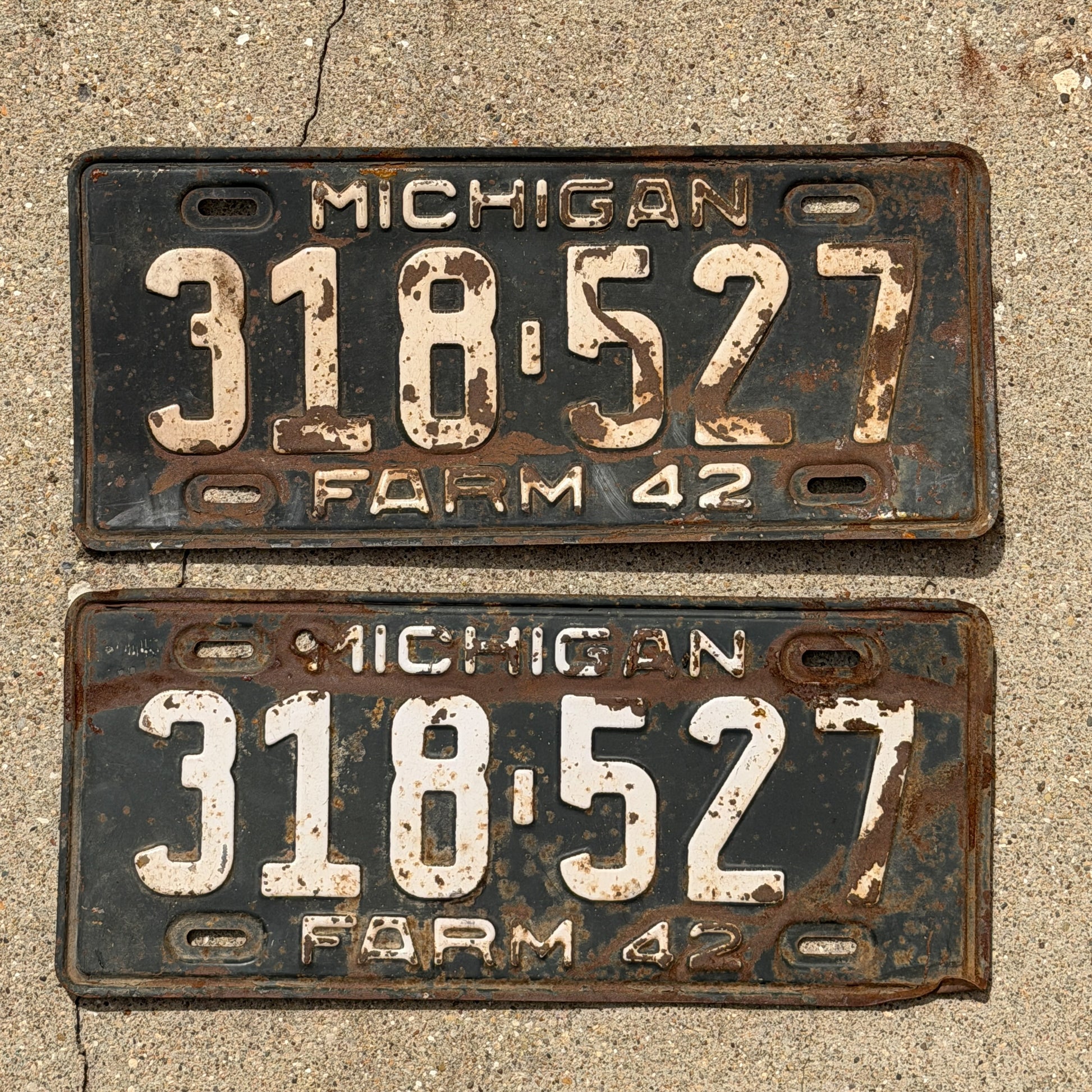 Photo of a 1942 Michigan Farm License Plate Pair Auto Tag Garage Decor Vintage 318 527 with original patina