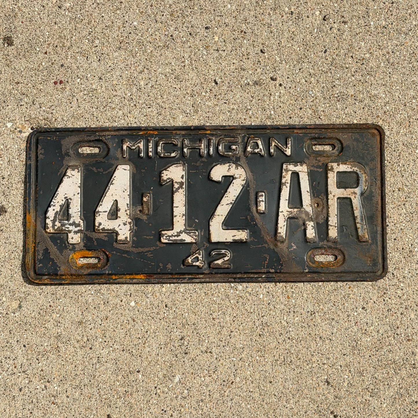 Photo of a 1942 Michigan License Plate Auto Tag Garage Decor Vintage 44 12 AR with original patina
