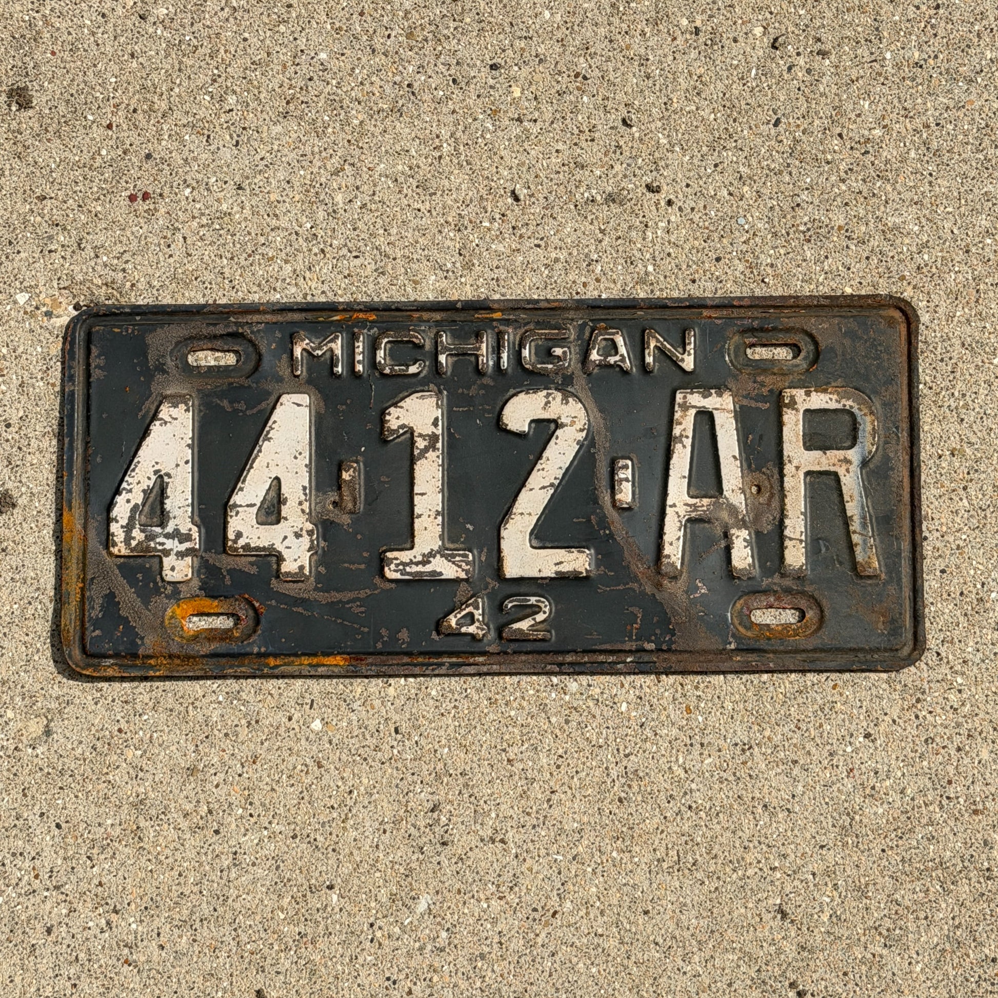 Photo of a 1942 Michigan License Plate Auto Tag Garage Decor Vintage 44 12 AR with original patina