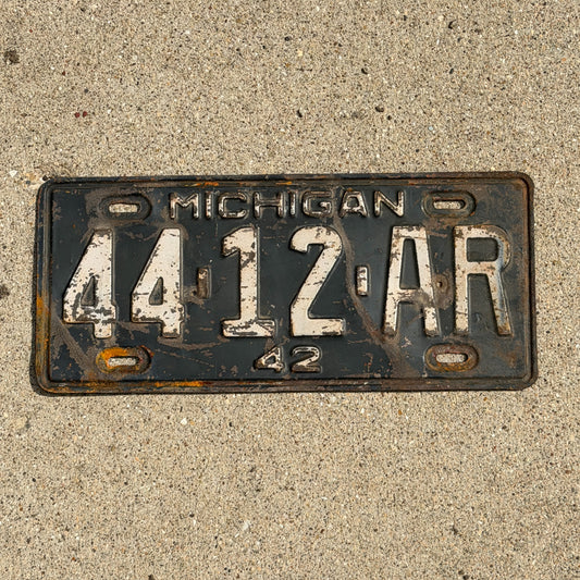 Photo of a 1942 Michigan License Plate Auto Tag Garage Decor Vintage 44 12 AR with original patina