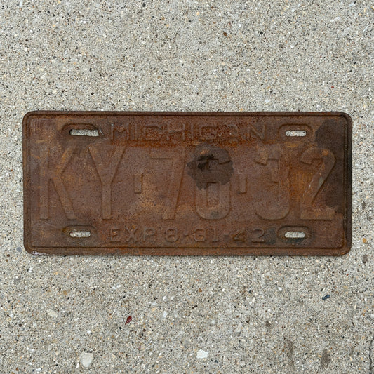 Photo of a 1942 Michigan License Plate Auto Tag Garage Decor Vintage Half Year KY 76 32 with original patina