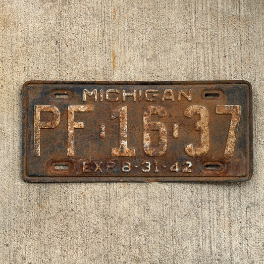Photo of a 1942 Michigan License Plate Auto Tag Garage Decor Vintage Half Year PF 16 37 with original patina
