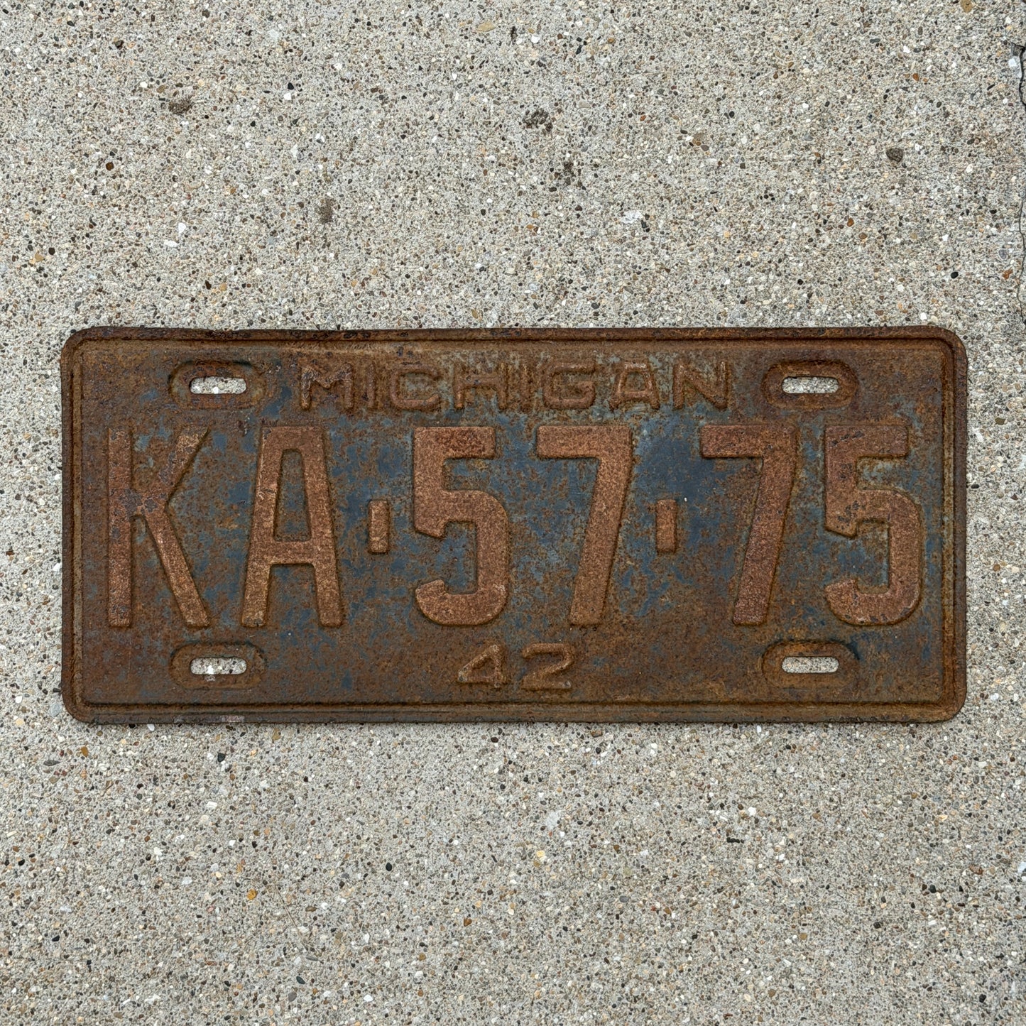 Photo of a 1942 Michigan License Plate Auto Tag Garage Decor Vintage KA 57 75 with original patina