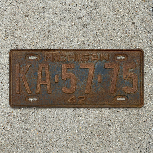 Photo of a 1942 Michigan License Plate Auto Tag Garage Decor Vintage KA 57 75 with original patina