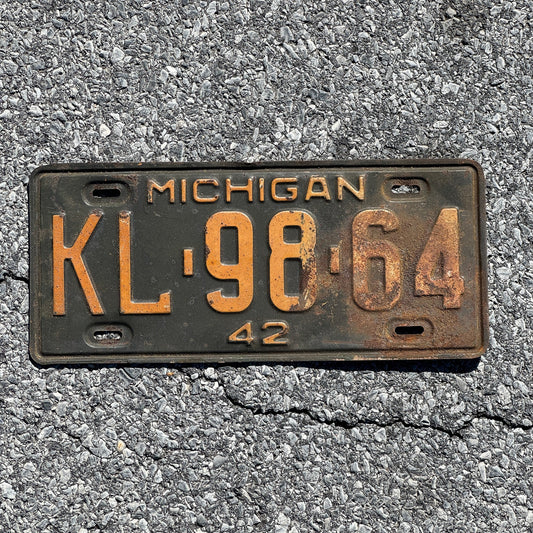 Photo of a 1942 Michigan License Plate Auto Tag Garage Decor Vintage KL 98 64