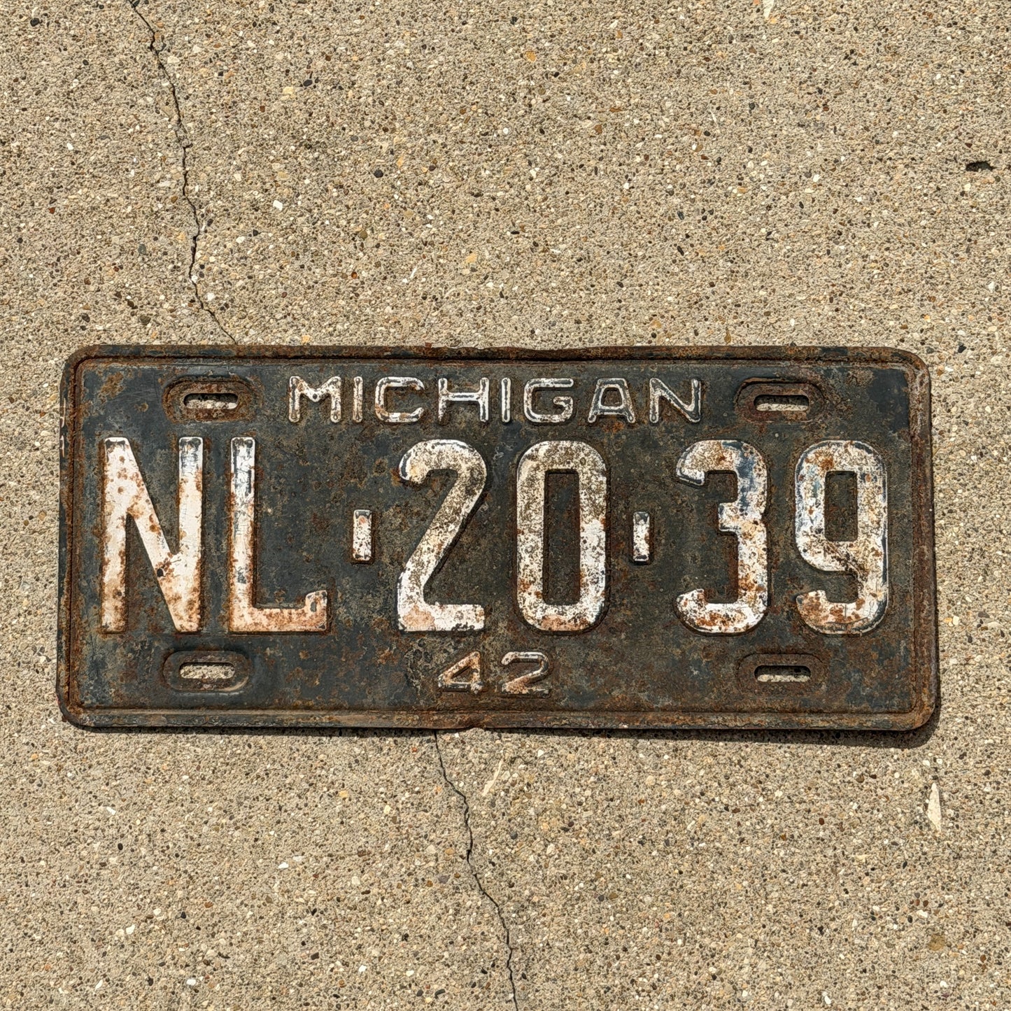 Photo of a 1942 Michigan License Plate Auto Tag Garage Decor Vintage NL 20 39 with original patina