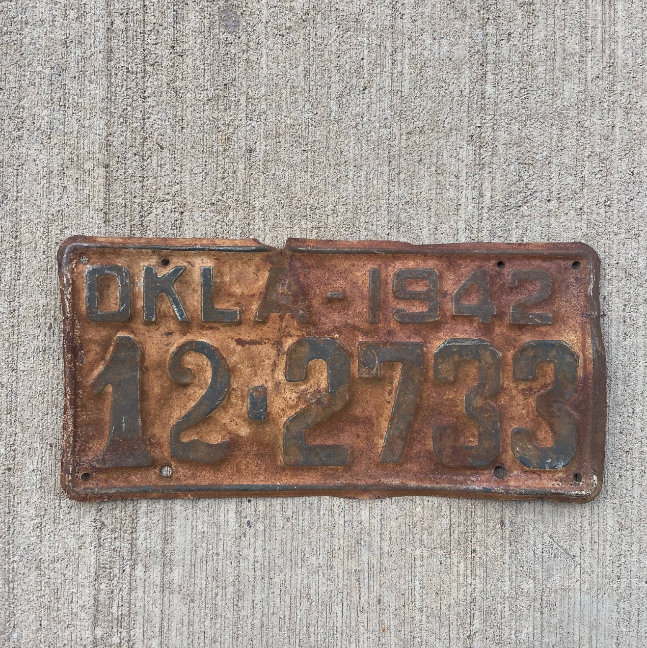 Photo of a 1942 Oklahoma License Plate Auto Tag Garage Decor Vintage 12 2733 with original patina