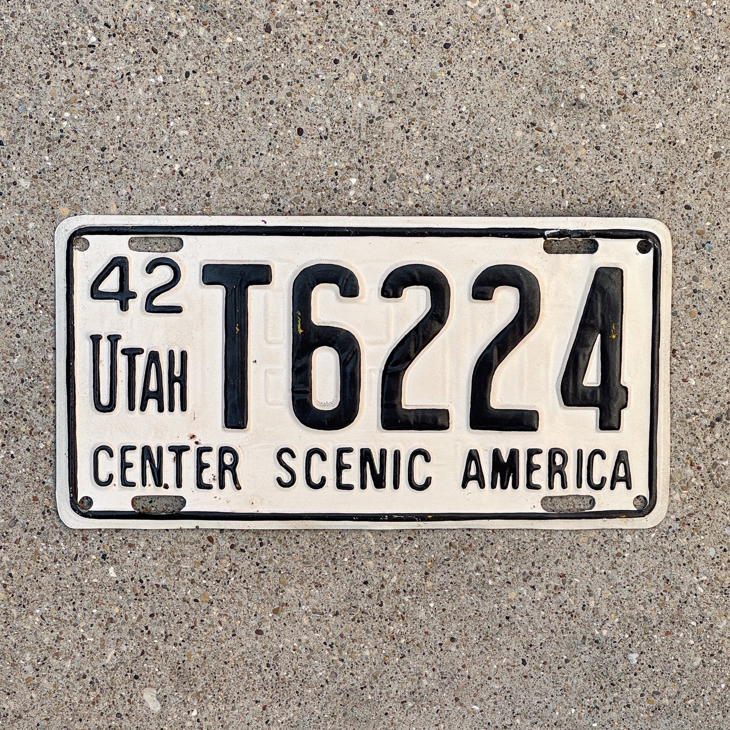 Photo of a 1942 Utah License Plate Auto Tag Garage Decor Vintage Overstamp Reused 1941 WWII T 6224 with original patina