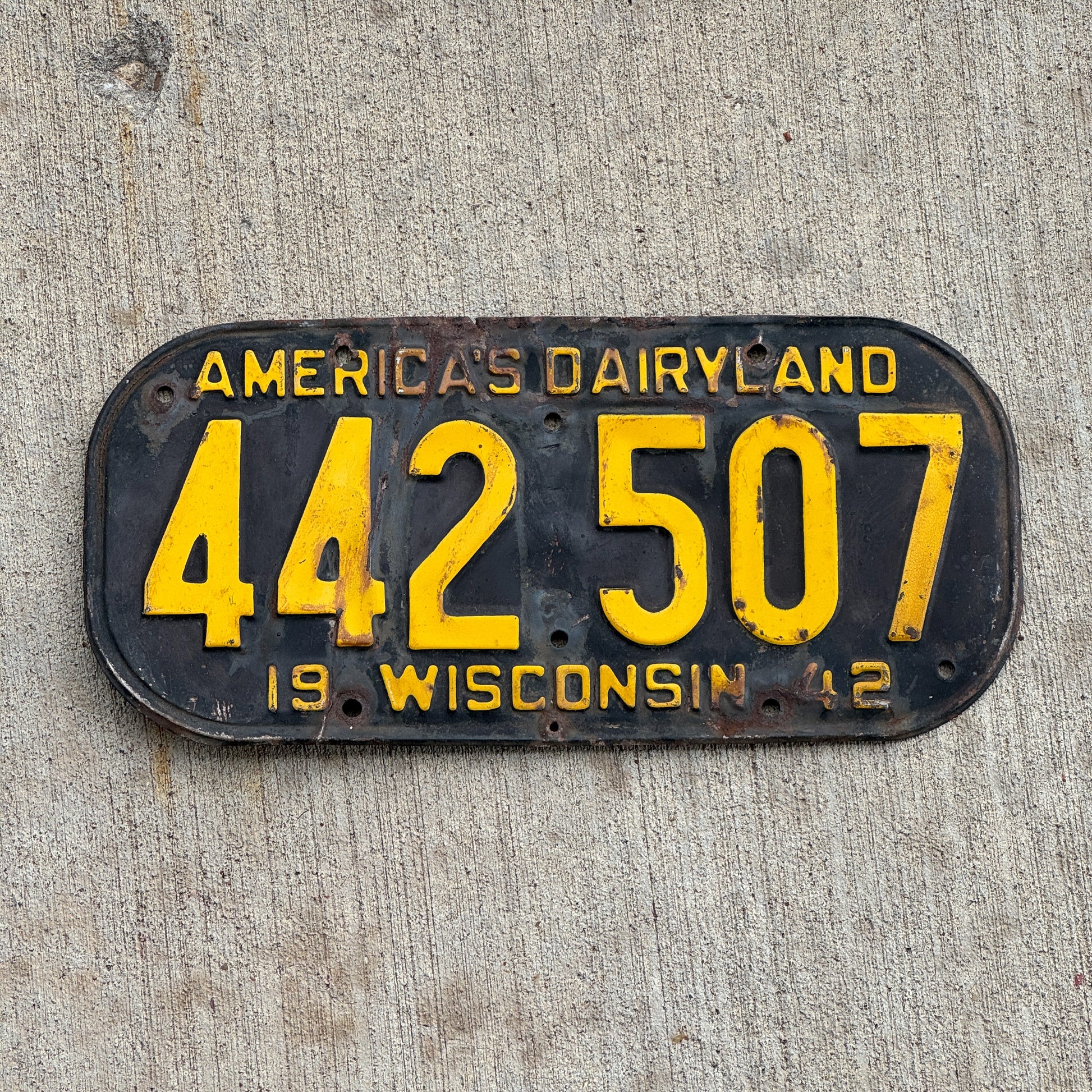 Photo of a 1942 Wisconsin License Plate Auto Tag Garage Decor Vintage 442 507 with original patina