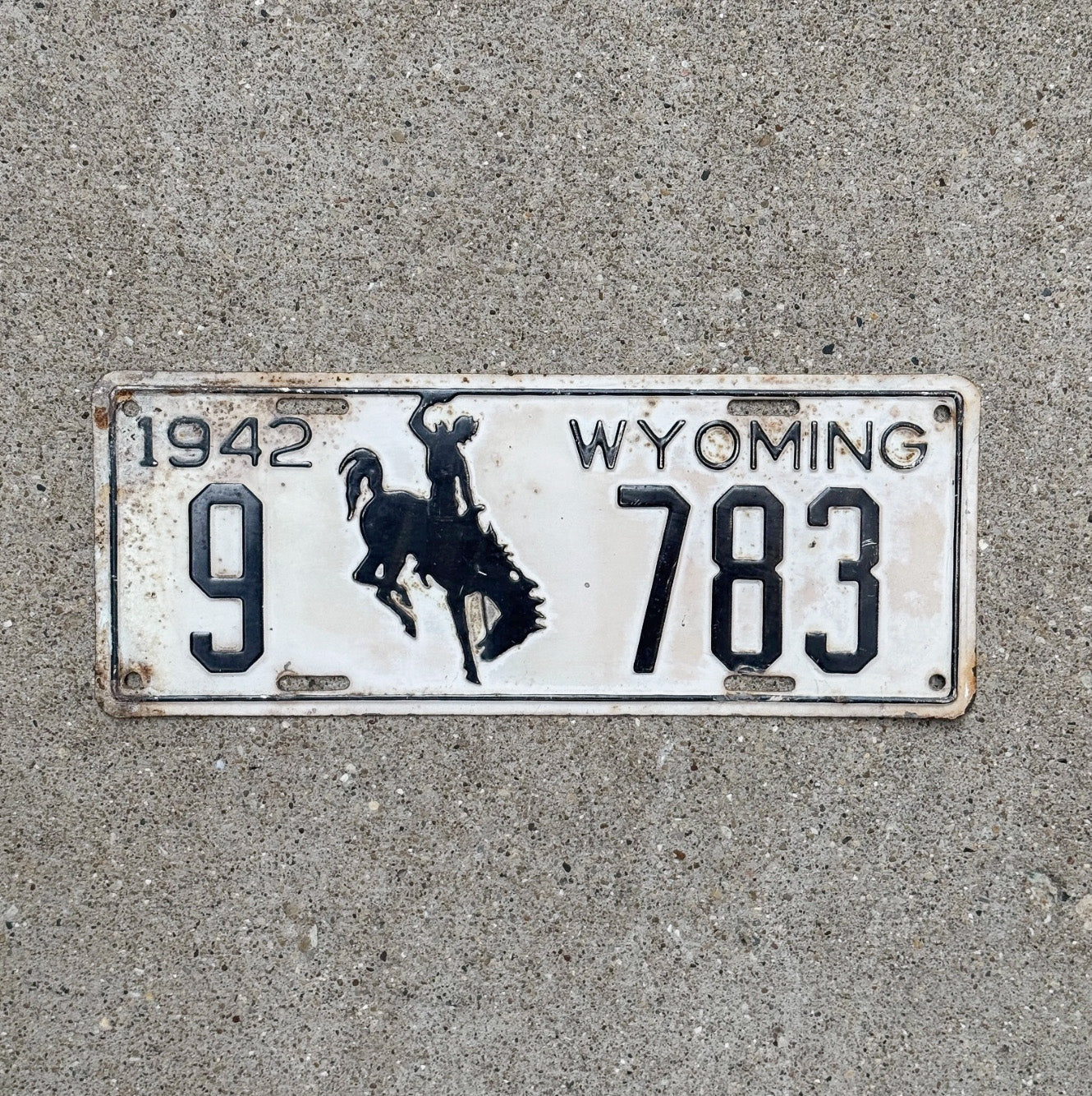 Photo of a 1942 Wyoming License Plate Auto Tag Garage Decor Vintage Low Number Four Digit 9 783 with original patina