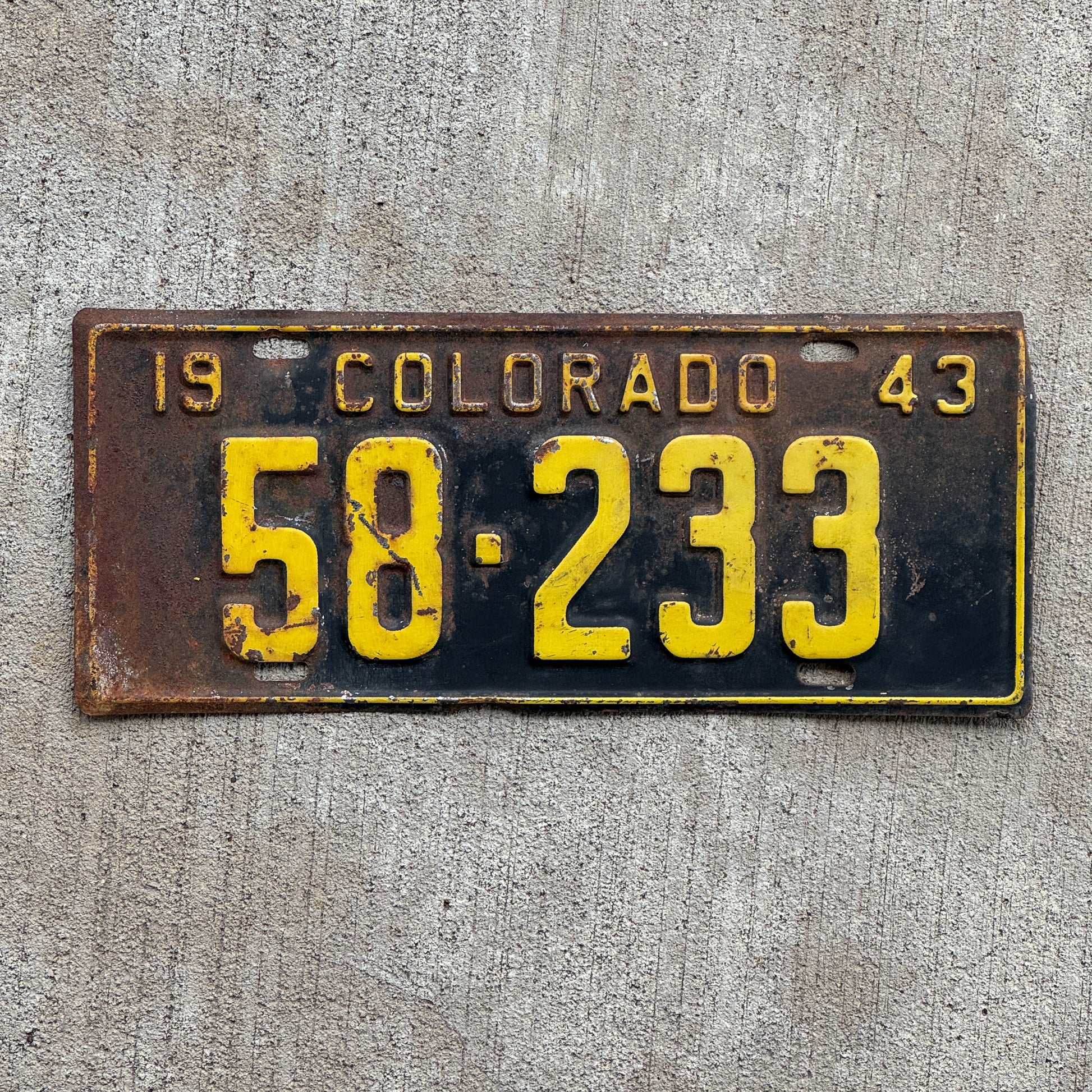 Photo of a 1943 Colorado License Plate Auto Tag Garage Decor Vintage 58 233 with original patina