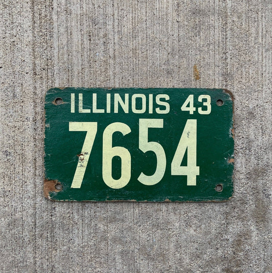 Photo of a 1943 Illinois Fiberboard License Plate Auto Tag Garage Decor Vintage Low Number Four Digit 7654 with original patina