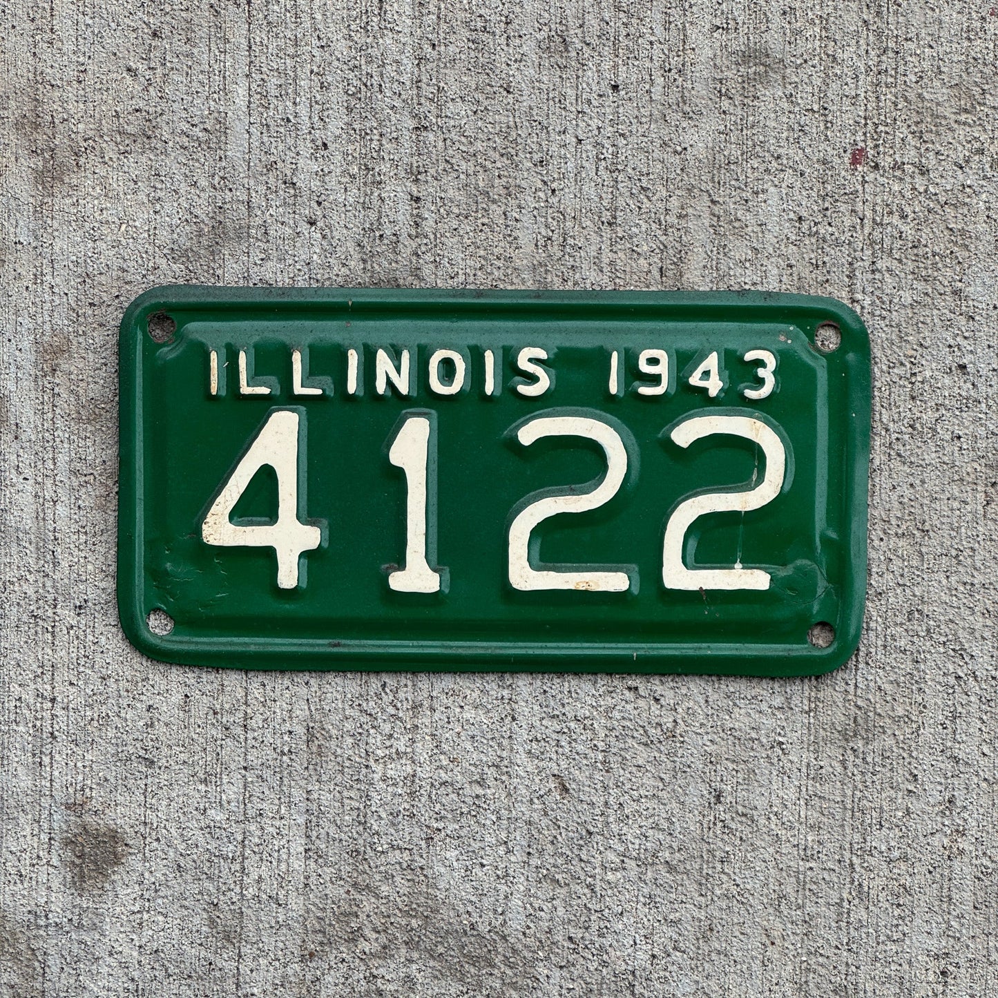 Photo of a 1943 Illinois Motorcycle License Plate Auto Tag Garage Decor Vintage Low Number Four Digit 4122 with original patina