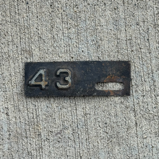 Photo of a 1943 New Jersey Tab License Plate Auto Tag Garage Decor Vintage with original patina