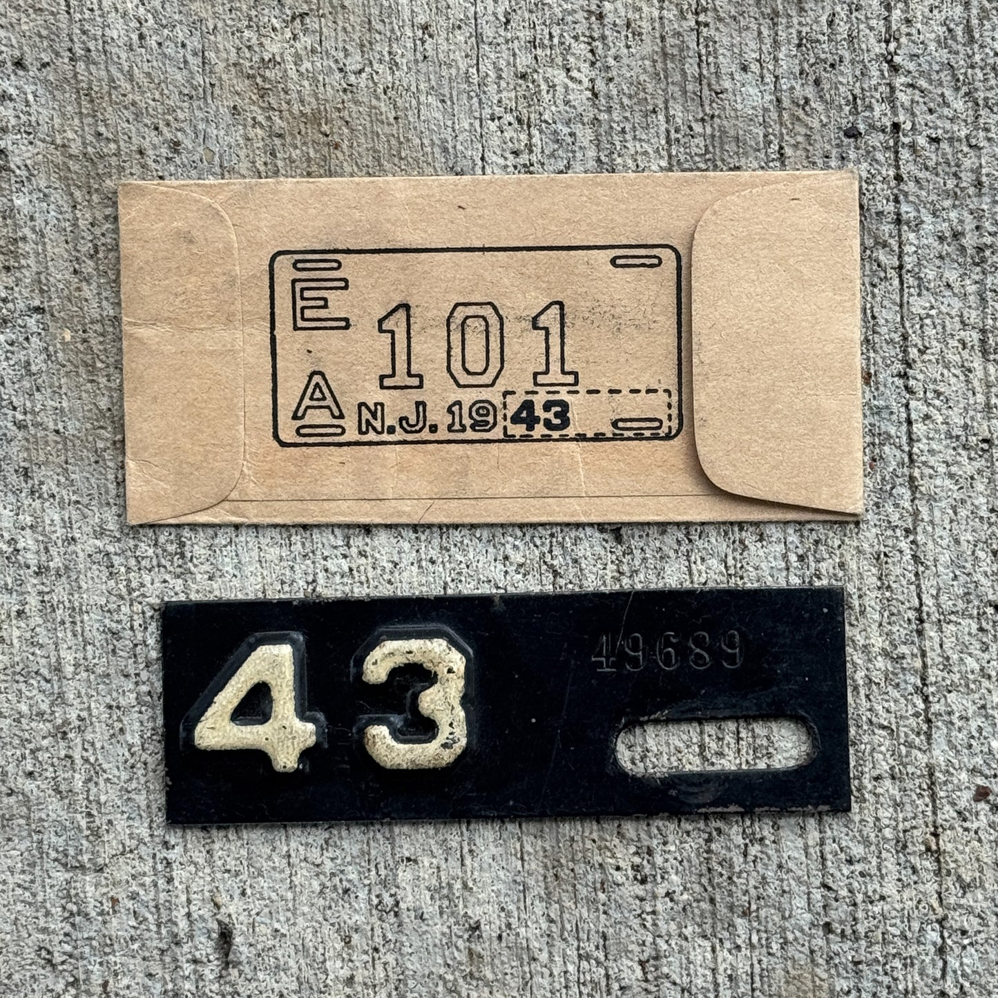 Photo of a 1943 New Jersey Tab License Plate Auto Tag Garage Decor Vintage With Envelope (non matching numbers) 49689.