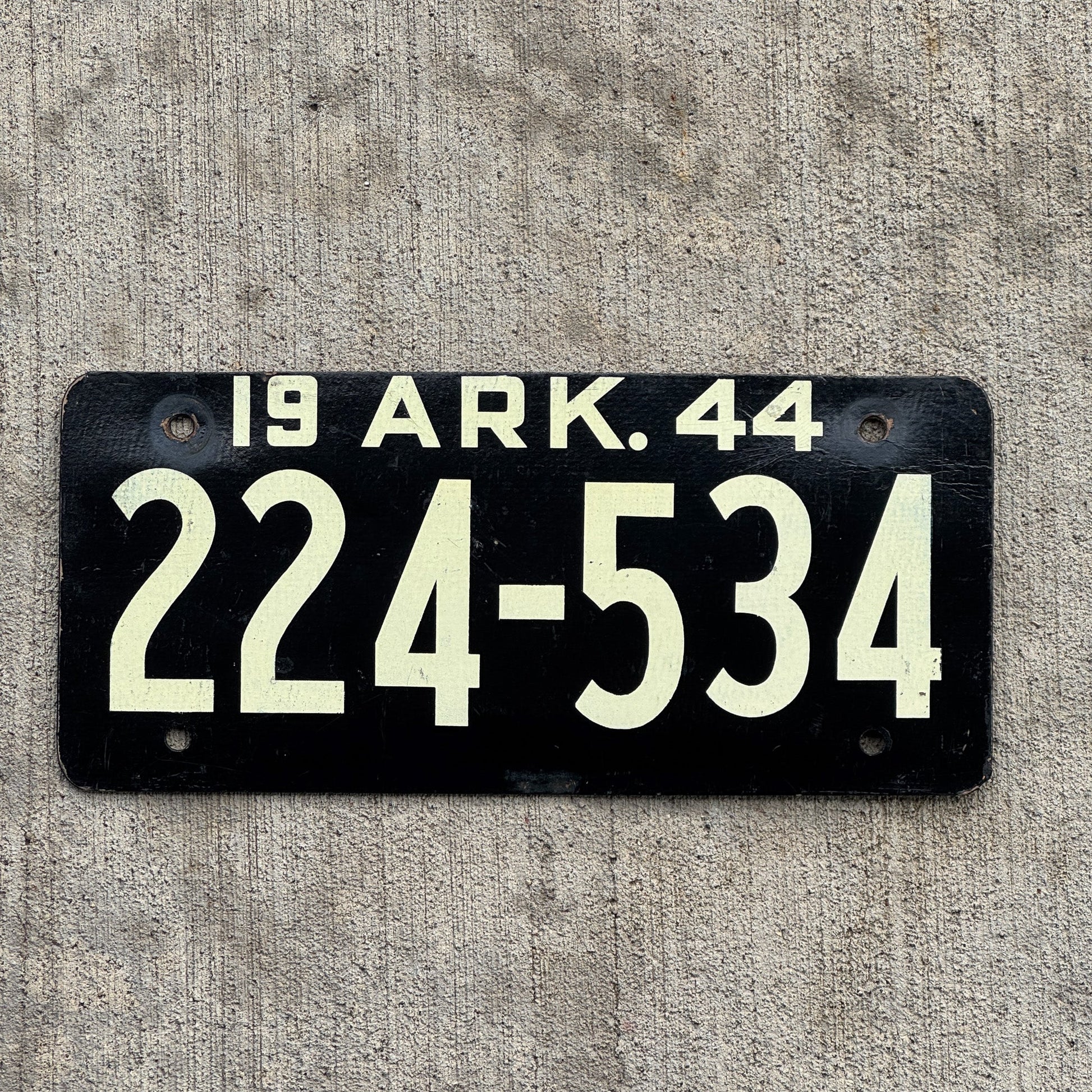 Photo of a 1944 Arkansas Fiberboard License Plate Auto Tag Garage Decor Vintage High Quality 224 534 with original patina