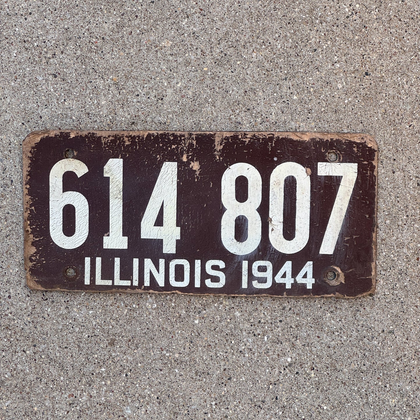 Photo of a 1944 Illinois Fiberboard License Plate Auto Tag Garage Decor Vintage 614 807 with original patina