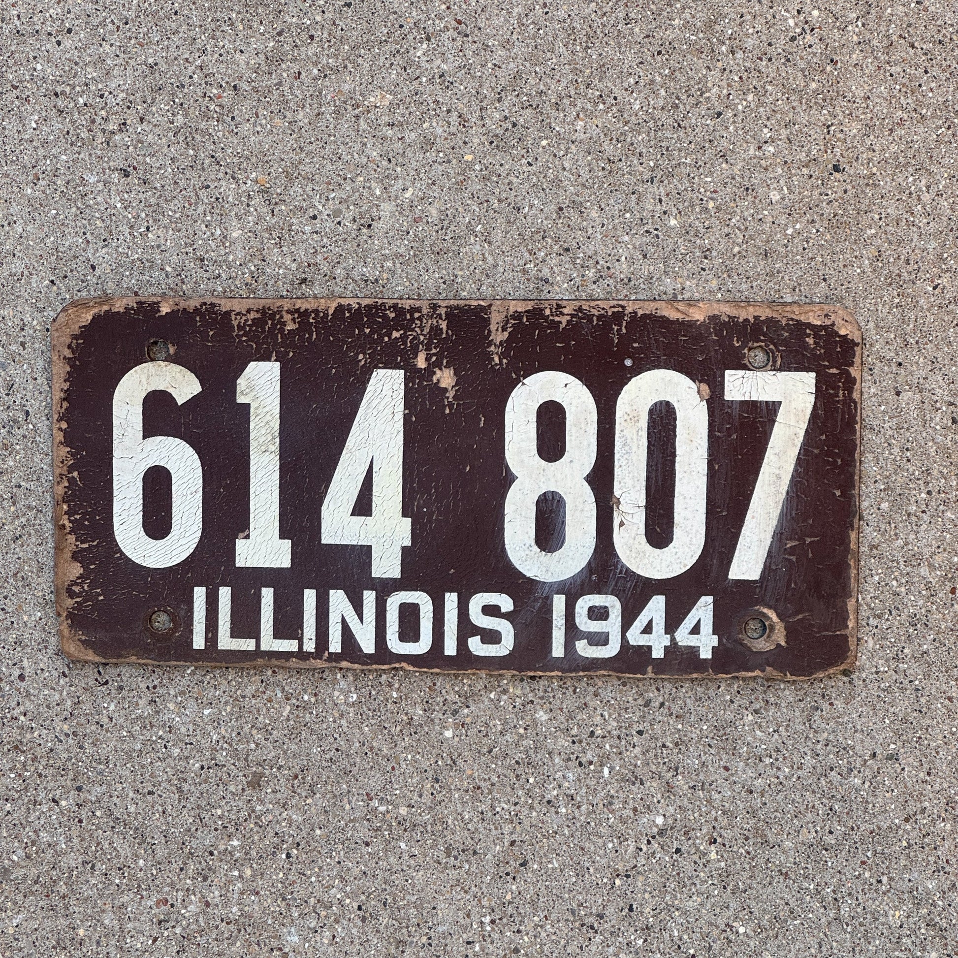Photo of a 1944 Illinois Fiberboard License Plate Auto Tag Garage Decor Vintage 614 807 with original patina