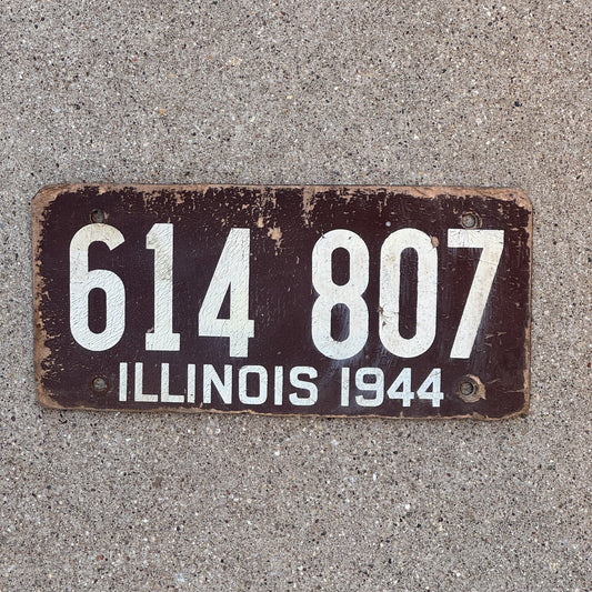Photo of a 1944 Illinois Fiberboard License Plate Auto Tag Garage Decor Vintage 614 807 with original patina