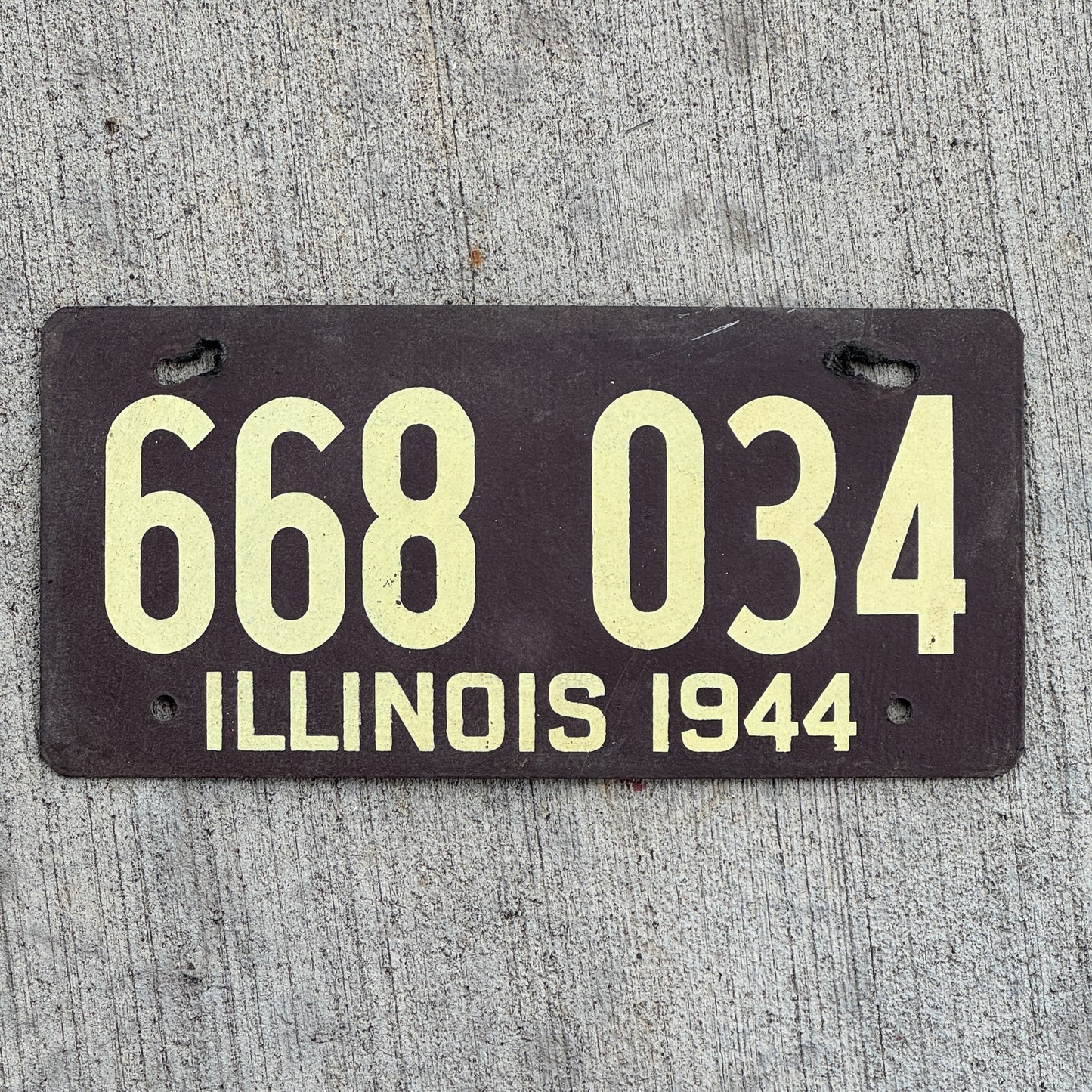 Photo of a 1944 Illinois Fiberboard License Plate Auto Tag Garage Decor Vintage 668 034 with original patina