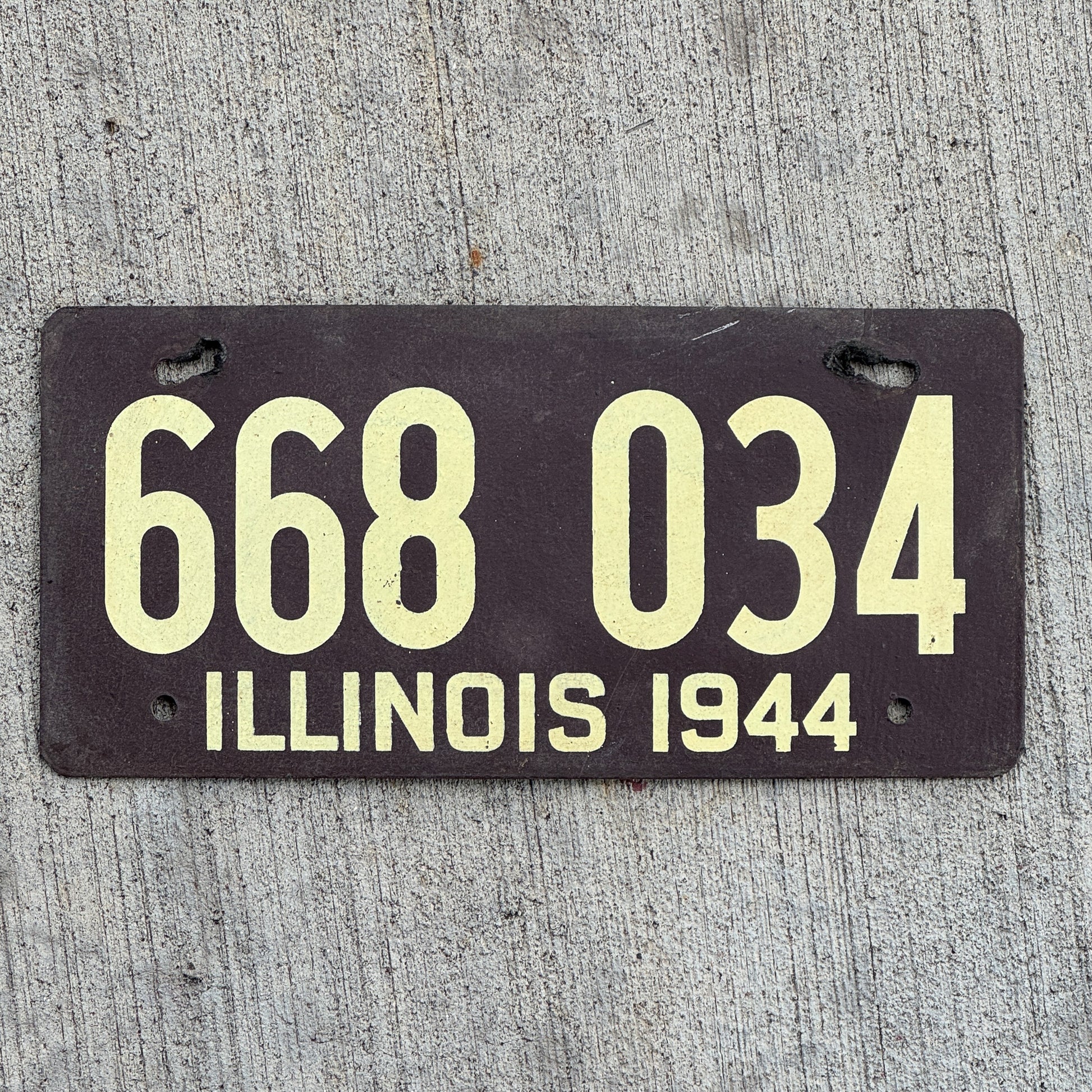 Photo of a 1944 Illinois Fiberboard License Plate Auto Tag Garage Decor Vintage 668 034 with original patina