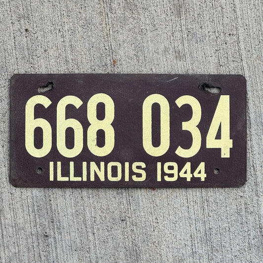 Photo of a 1944 Illinois Fiberboard License Plate Auto Tag Garage Decor Vintage 668 034 with original patina