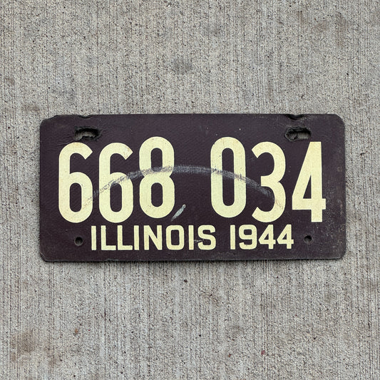 Photo of a 1944 Illinois Fiberboard License Plate Auto Tag Garage Decor Vintage 668 034 with original patina