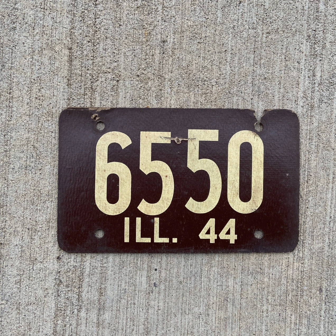 Photo of a 1944 Illinois Fiberboard License Plate Auto Tag Garage Decor Vintage Low Number Four Digit 6550 with original patina