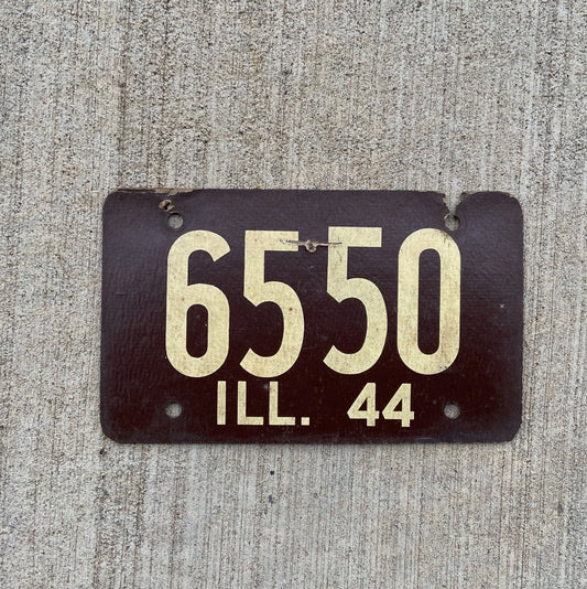 Photo of a 1944 Illinois Fiberboard License Plate Auto Tag Garage Decor Vintage Low Number Four Digit 6550 with original patina