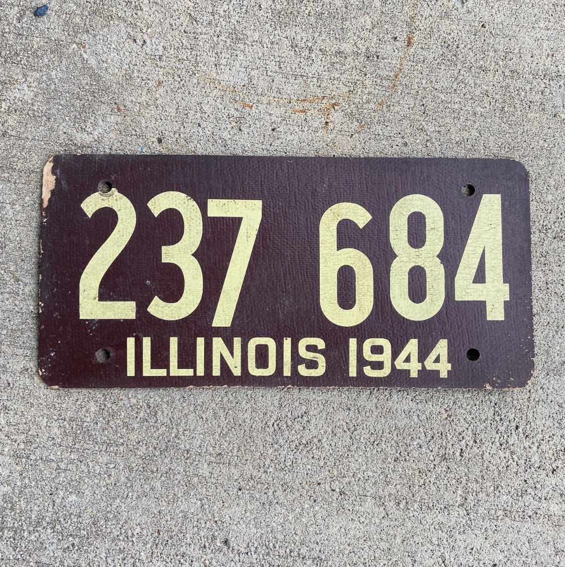 Photo of a 1944 Illinois Fiberboard License Plate Auto Tag Garage Decor Vintage WWII War Year 237 684 with original patina