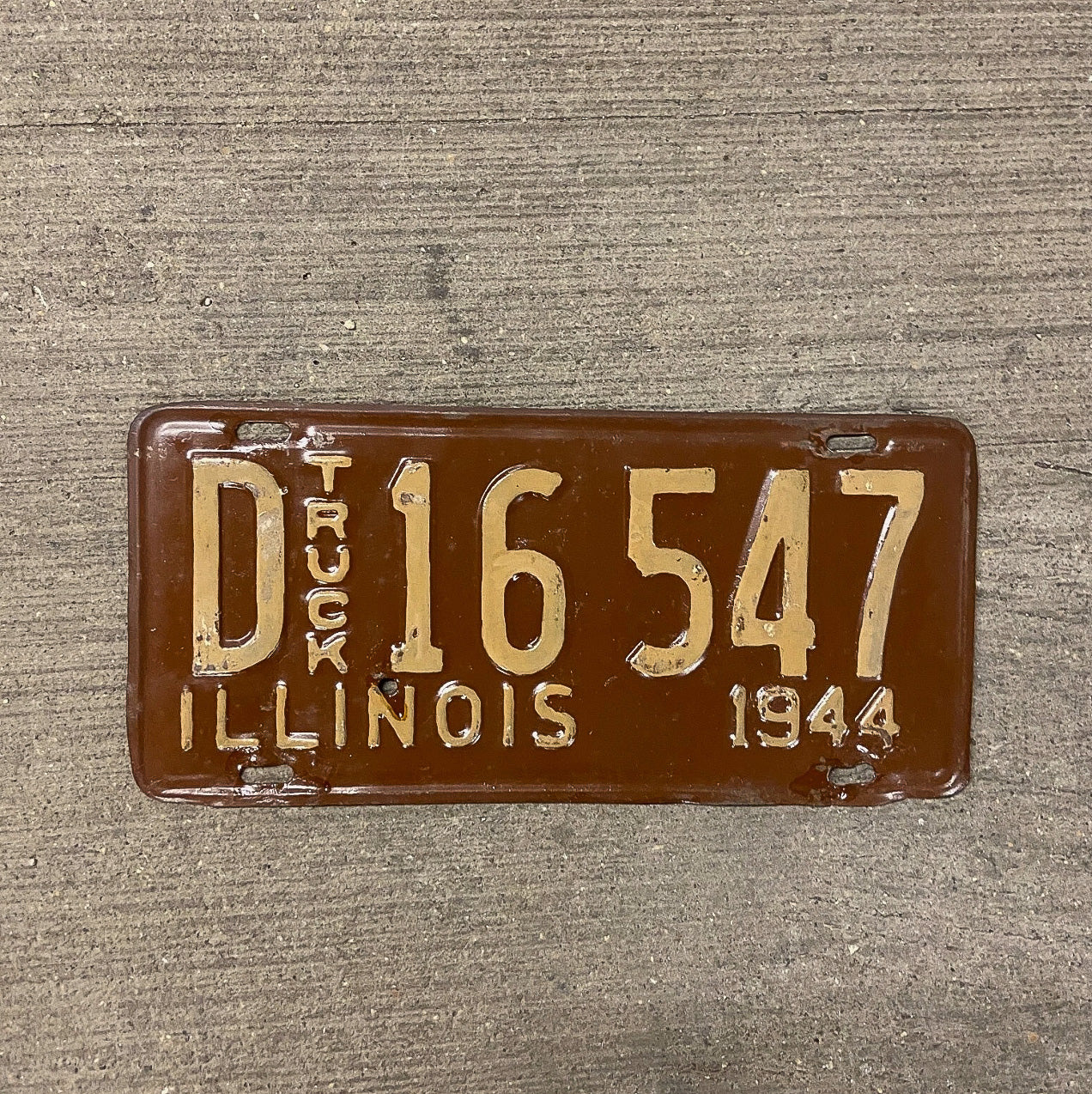 Photo of a 1944 Illinois Truck License Plate Auto Tag Garage Decor Vintage D 16547 with original patina