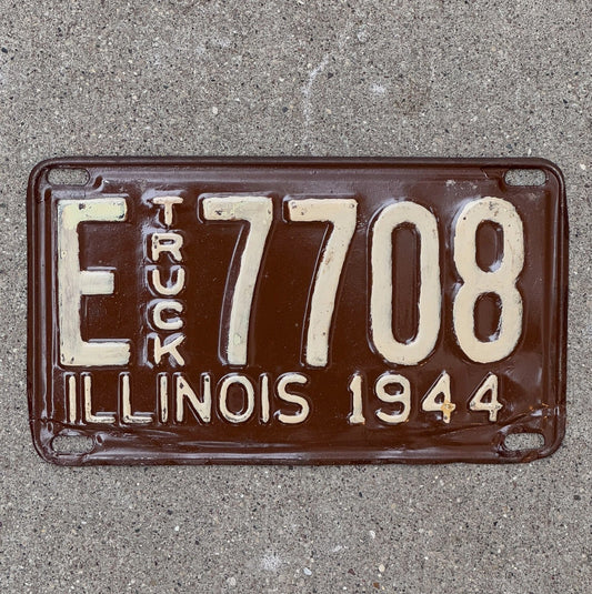 Photo of a 1944 Illinois Truck License Plate Auto Tag Garage Decor Vintage E 7708