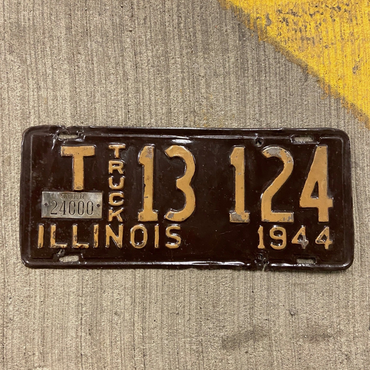 Photo of a 1944 Illinois Truck Mileage Tax License Plate Auto Tag Garage Decor Vintage T 13124 with original patina