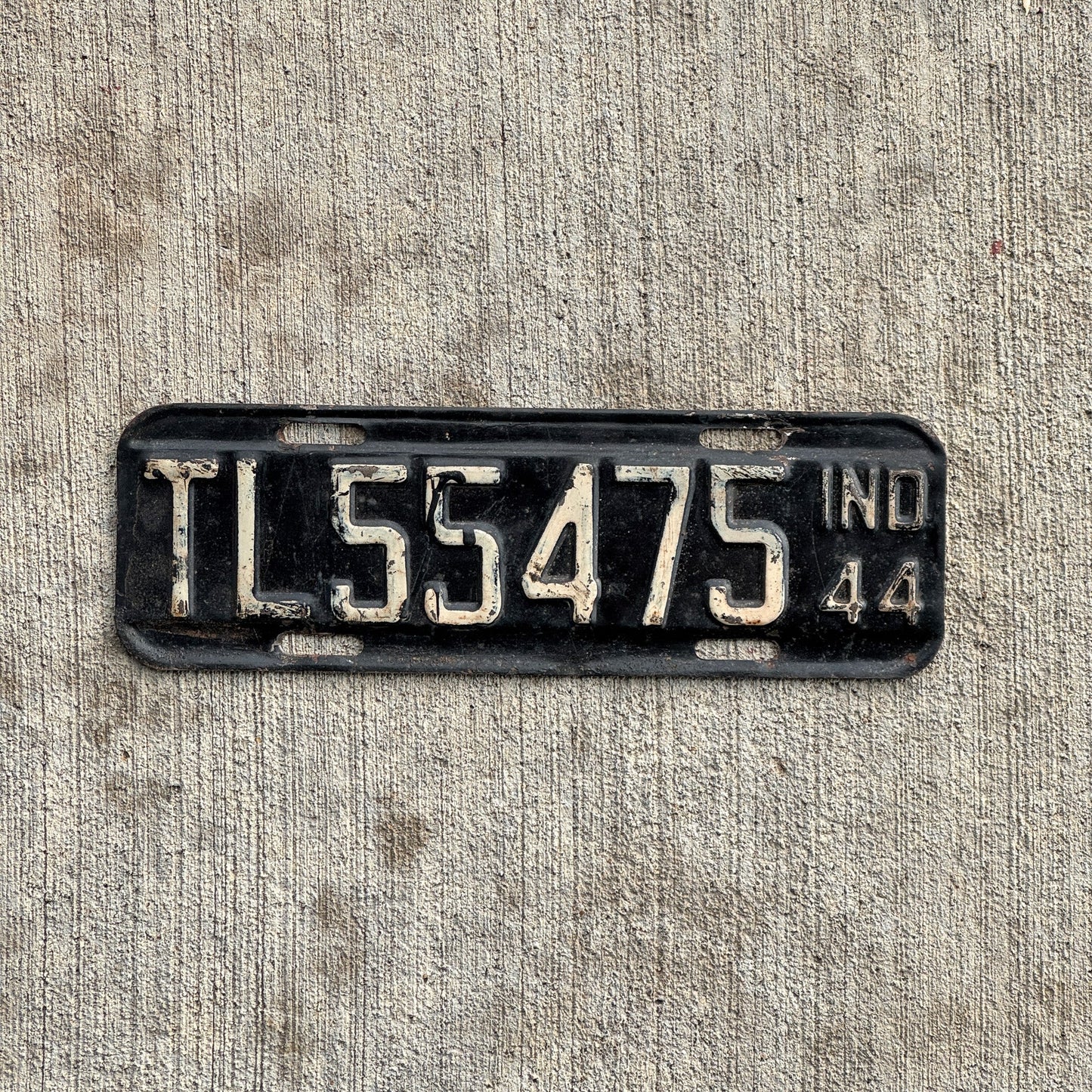 Photo of a 1944 Indiana Trailer License Plate Auto Tag Garage Decor Vintage Small War Year TL 55475 with original patina