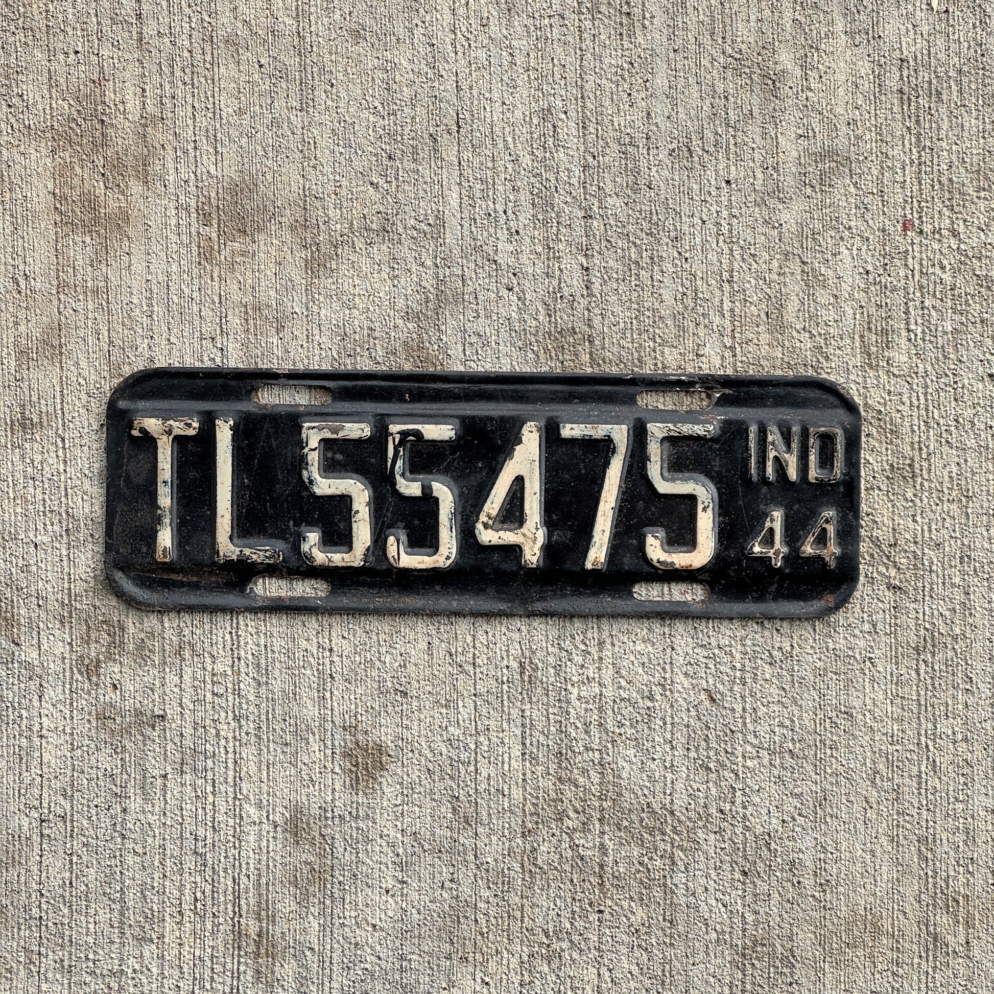 Photo of a 1944 Indiana Trailer License Plate Auto Tag Garage Decor Vintage Small War Year TL 55475 with original patina