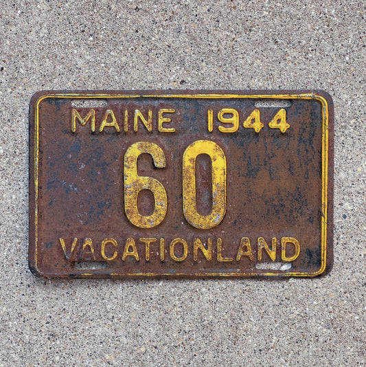 Photo of a 1944 Maine License Plate Auto Tag Garage Decor Vintage Low Number Two Digit 60 with original patina