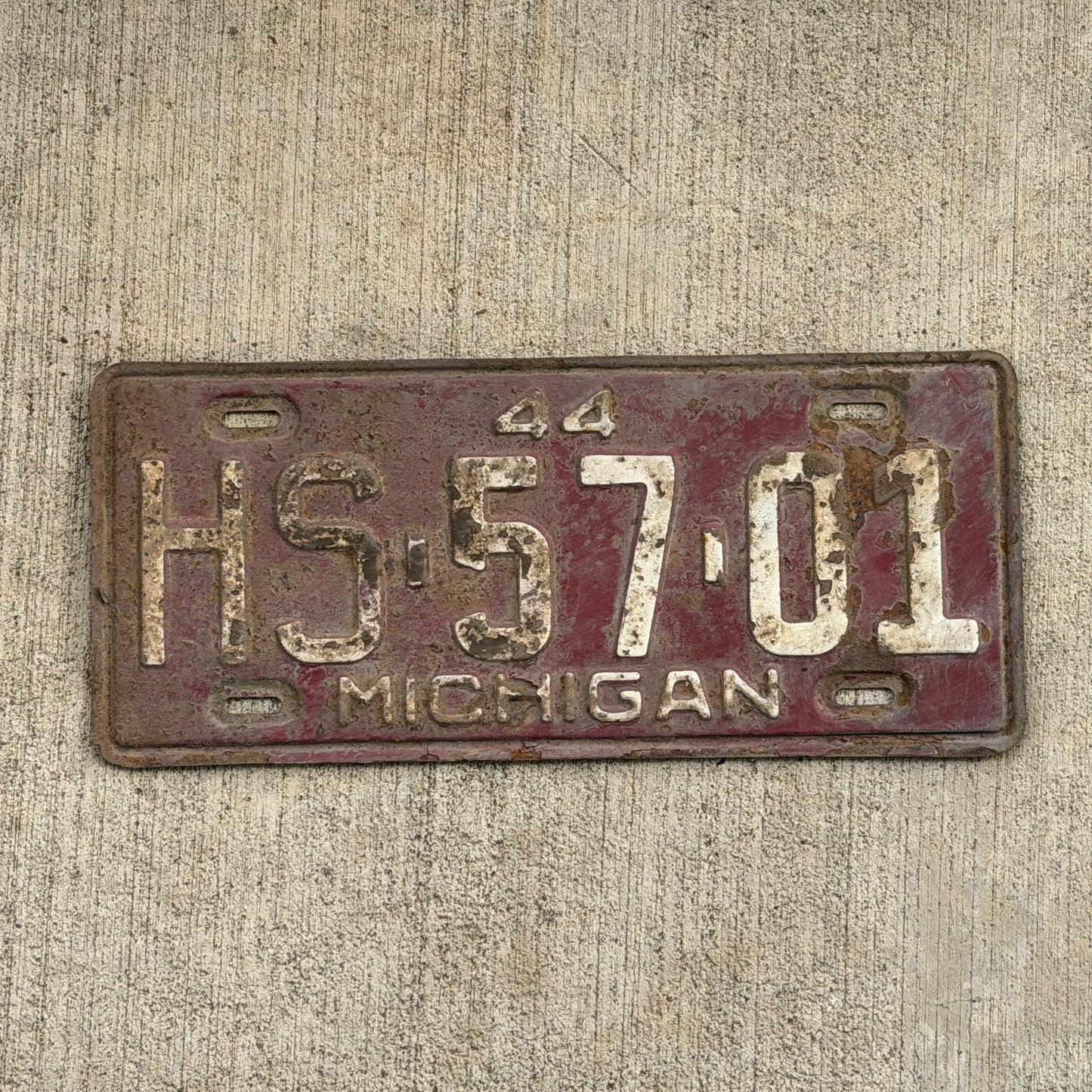 Photo of a 1944 Michigan License Plate Auto Tag Garage Decor Vintage HS 57 01 with original patina